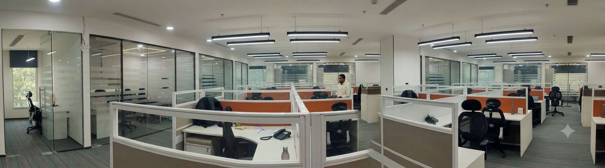 Quiet focus zones along the Zydus Wellness floor plate with vertical fluted panel detailing